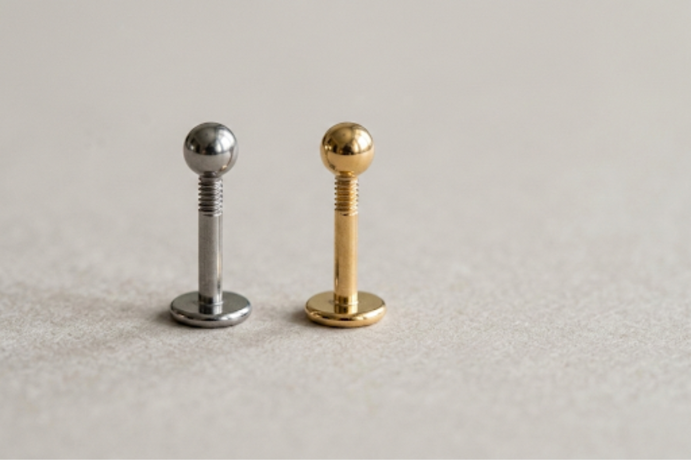Ear Piercing Jewellery - Titanium vs Gold (What We’d Choose and Why)