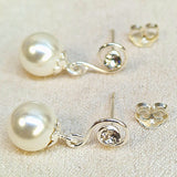 Silver Drop Dangle Pearl Earrings Spiral Design with Crystal adding a touch of sparkle to the intricate design