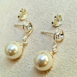 Silver Drop Dangle Pearl Earrings Spiral Design with Crystal adding a touch of sparkle to the intricate design