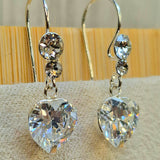 Silver Drop Dangle Heart CZ Crystal Earrings this exquisite earring captivates with its timeless elegance.